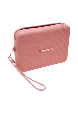 Portamonete rettangolare rosa con texture, chiusura con cerniera e logo "havaianas" sul davanti, con cinturino abbinato.