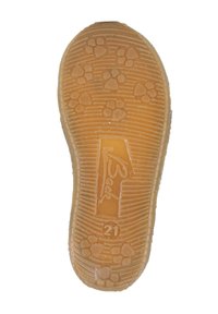 Gummisohle, beige, mit einem gemusterten Profil in Form von Pfotenabdrücken. Eingraviertes Logo und sichtbare Größe "21". Strukturiert Linien überall.