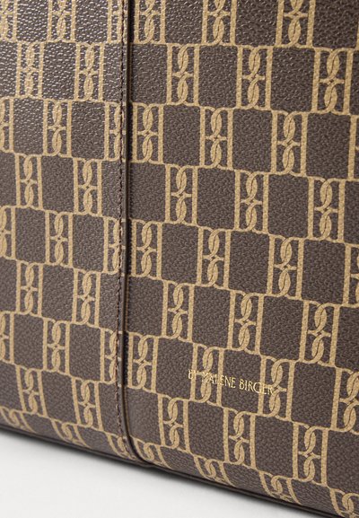Brown textured handbag featuring a beige geometric pattern and gold embossed logo, with a structured design and smooth finish.