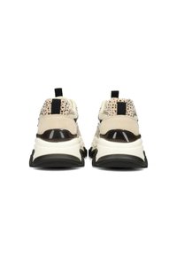 Beige and black sneakers viewed from the back, featuring a speckled design, cushioned sole, and pull-tab on the heel.