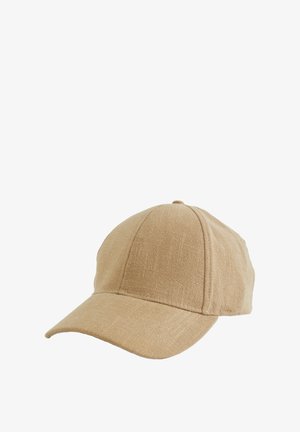 Tan fabric baseball cap with curved visor, textured surface, six-panel design, and adjustable strap at the back.