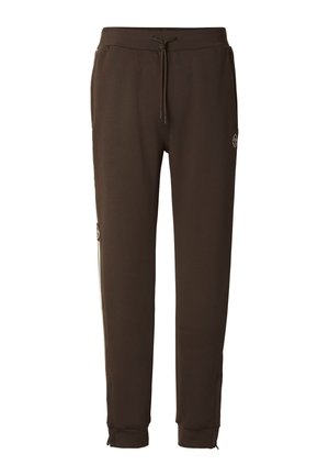 Brune joggebukser med snor i livet, smale ben, elastiske mansjetter og stripes på sidene. Laget av mykt stoff med glatt tekstur.