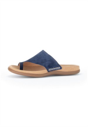 Navy blue suede slide sandal with a peep toe, curved footbed, and beige rubber sole; features white stitching detail on side.