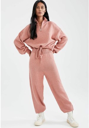 JOGGER - Tracksuit bottoms - pink