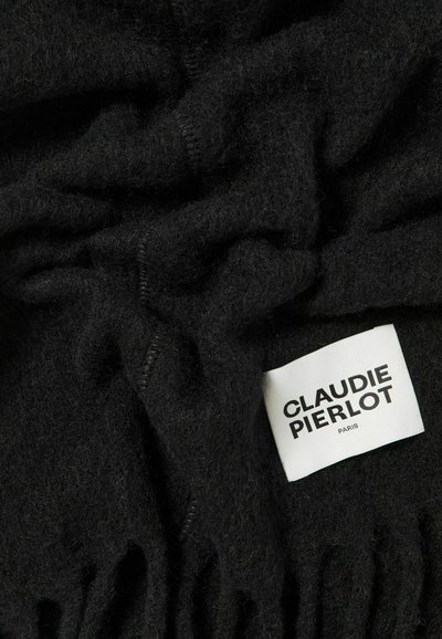 Sciarpa in lana nera con una superficie morbida e texturizzata. Presenta bordi frangiati e un'etichetta con la scritta "CLAUDIE PIERLOT PARIS" in caratteri in grassetto.