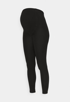 Schwarze Schwangerschaftsleggings aus einem glatten, dehnbaren Stoff. Mittelhoher Bund passt sich einem wachsenden Bauch an. Figurbetonter Schnitt, lange Beine.