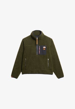 Pull-over en polaire vert foncé avec zip quart et poche poitrine zippée, dotée d'une poche en tissu noir contrastant et de poches latérales zippées.