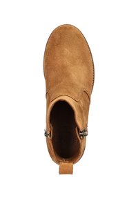 Brown suede ankle boot with a rounded toe, curved side edges, and decorative metal hardware on the ankle strap. Flat sole with a textured finish.