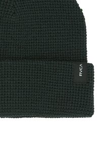 Black waffle knit beanie with folded cuff featuring a small black label with white RVCA logo on the side.