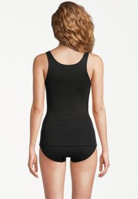 Black tank top with a smooth texture and rounded neckline, paired with matching black shorts. View from the back.