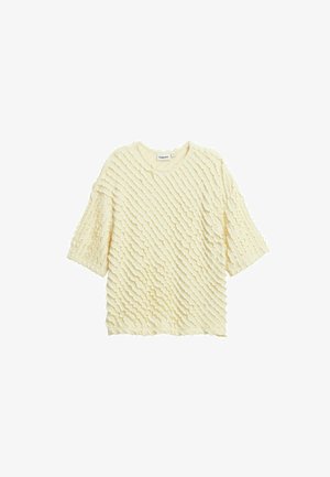 Haut en tricot crème à manches courtes avec des rayures texturées diagonales et un col rond, posé à plat sur un fond blanc.