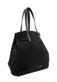 Sac fourre-tout noir souple avec des poignées en cuir tressé et une petite étiquette logo à l'avant sur fond blanc.