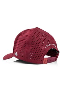 Red cap featuring a perforated design for ventilation, curved brim, and adjustable strap at the back. White text reads "KEEP GOING."
