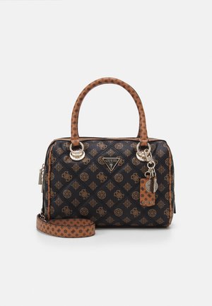 Black and brown Guess handbag with patterned logo, double handles, detachable strap, and metal logo charm on front, rectangular shape.