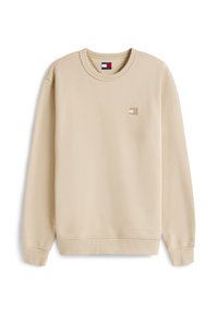 Sudadera beige con textura acanalada, cuello redondo y mangas largas. Pequeño parche de logo en el pecho. Acabado de tela suave.