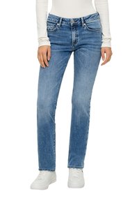 Světle modré džíny z denimu se střihem rovného nohavice, pět kapsami a jemnými detaily šití. V kombinaci s bílými teniskami.