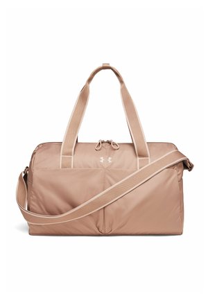 Light pink soft fabric duffel bag with two short handles, a long adjustable shoulder strap, front zipper pocket, and Under Armour logo.