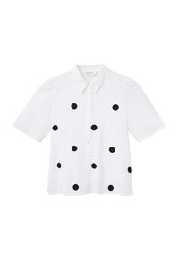 Camisa blanca de manga corta con cuello abotonado, con grandes lunares negros y un corte holgado. Tejido de algodón suave.