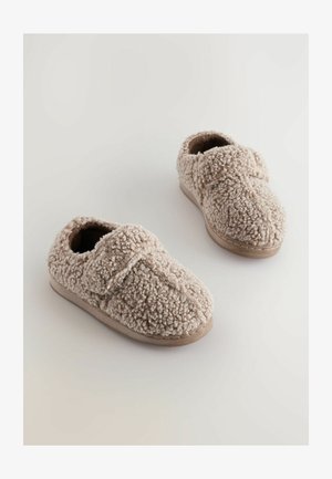 Saboti bej pufoși cu un superior texturat, curea ajustabilă și talpă din cauciuc. Material moale și pufos pentru confort și căldură.