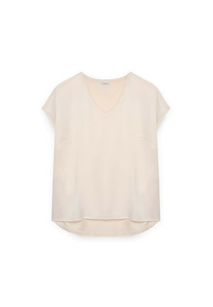 Blouse à manches courtes et col en V en beige pâle, en tissu lisse. Présente une coupe ample et deux poches avant, avec un ourlet arrondi.