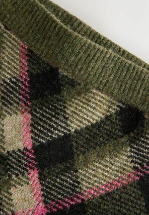Green wool fabric with a black, cream, and pink argyle pattern and a ribbed knit edge.
