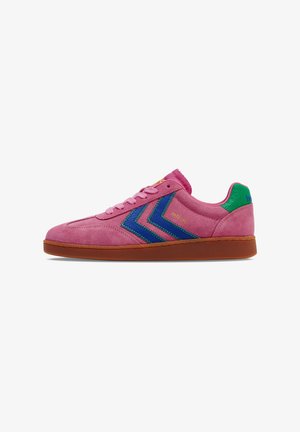Pink suede sneaker with blue and green chevron accents, flat brown rubber sole, round toe, and padded tongue.