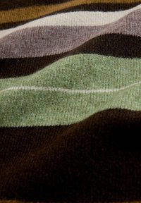 Knit fabric with horizontal stripes in shades of green, brown, cream, and dark brown. Soft texture with slightly raised patterns.