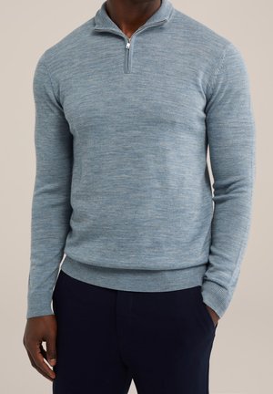 Light blue knit pullover with a zip collar, ribbed cuffs, and hem. The fabric has a soft texture and a blended color pattern.
