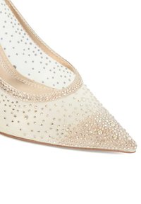 Beige satin pointed-toe shoe with a mesh upper, adorned with scattered rhinestones and a subtle, shimmering design around the edge.