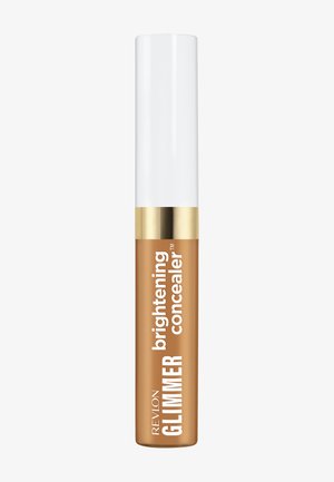 Revlon Glimmer aufhellender Concealer in einer Tube mit weißem Deckel und goldfarbenem Ring, in der mittleren Bräunungsnuance, auf neutralem Hintergrund dargestellt.