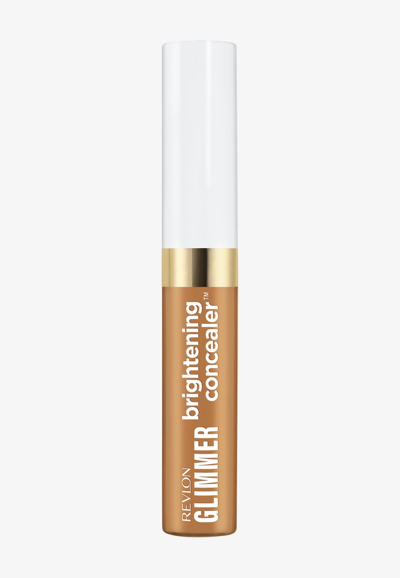 Tube de correcteur illuminateur Revlon Glimmer avec bouchon blanc et bande dorée, en teinte beige moyen, présenté sur un fond neutre.