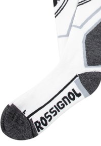 Media blanca con un diseño estampado, punta y talón grises, que presenta el texto negro "ROSSIGNOL" en el puño y un diseño geométrico en gris y negro.