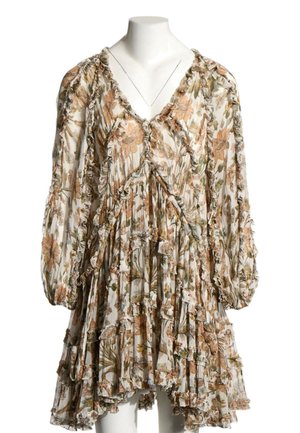 Robe ample à manches longues avec des bords volantés et un motif floral dans des tons de brun, vert et beige sur un fond clair.