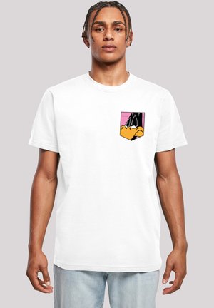 White cotton t-shirt featuring a rectangular pocket with a colorful cartoon character print in pink, orange, and black tones.