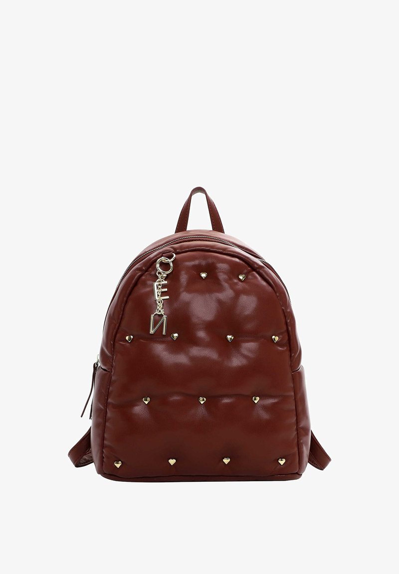 Brown padded backpack with gold heart-shaped studs and a gold letter charm hanging near the top zipper.
