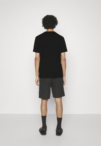 HUGO DULIVE - T-shirt estampada - black