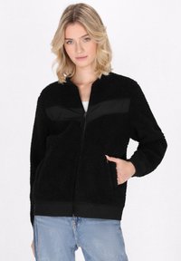 Schmuddelwedda Forro polar - schwarz