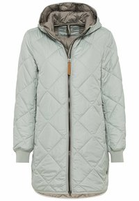 Veste matelassée vert clair avec capuche, fermeture éclair intégrale, poignets côtelés et texture lisse. Présente un motif de losanges en diagonale.