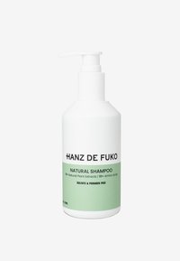 White bottle with a pump dispenser, green label, and black text. Label states "Natural Shampoo," sulfate and paraben-free. 276ml capacity.
