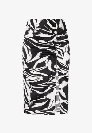 Mustvalge zebra-ribadega pliiatsiseelik, millel on rütmimise detail ja külgslits, valmistatud siledast kangast, näidates kitsast siluetti.