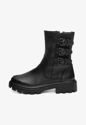 Black leather ankle boot with chunky sole and three adjustable side buckles on the upper shaft.