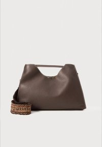 Brown leather handbag with a structured, angular shape. Features a short handle, a patterned removable strap, and subtle stitching details.