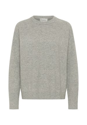 Šviesiai pilkas megztinis su apvalia iškirpte, pagamintas iš minkštos, struktūruotos medžiagos. Turi ilgomis rankovėmis bei ribomis apdailintus rankogalius ir apačią, užtikrinančius laisvą prigludimą.