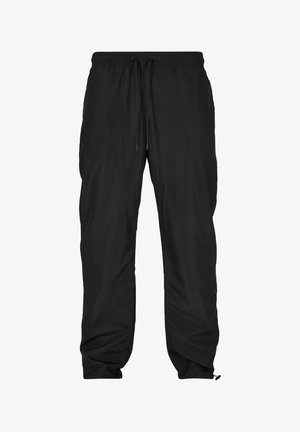 Fekete, könnyű, vízálló nadrág rugalmas derékkal, állítható zsinórral, oldalsó zsebekkel és szűkített szárakkal.