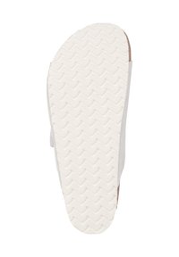 Vit gummiyttersula med zigzag-mönster, med rund tå och minimalistisk sidodesign. Texturerad för ökad grepp.