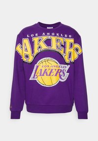 Sweat-shirt violet avec l'inscription « Los Angeles Lakers » en jaune et blanc, grand logo avec un ballon de basket, poignets et ourlet côtelés.