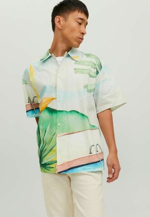 Short-sleeve shirt featuring a tropical print with blue, green, and orange hues, depicting plants and a pool. Made of lightweight fabric.