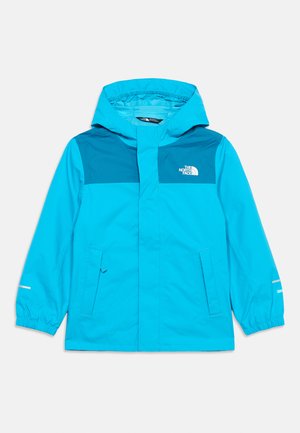 Svijetloplasta dječja kabanica s kapuljačom, dva prednja džepa, elastičnim manžetama i logom The North Face na prsima.