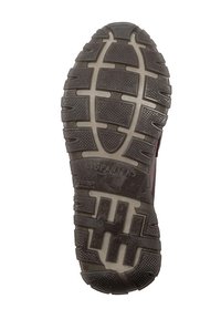 Podeszwa buta z teksturowaną, wzorzystą gumową powierzchnią z głębokim bieżnikiem, wyraźnie oznaczona napisem „HISPANITAS”. Kolor ciemnobrązowy.