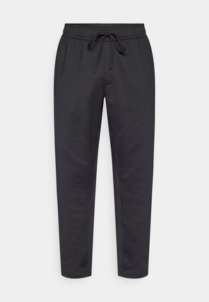 Mustad vabaajapüksid elastse vöörihma, reguleeritava nööriga ja kitseneva säärekujundusega. Valmistatud pehmest, siledast kangast.